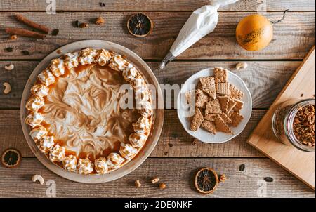 A decorating process of  Pumpkin Cheesecake - Thanksgiving dessert Stock Photo