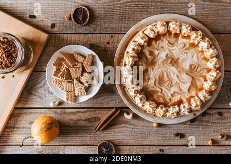 A decorating process of  Pumpkin Cheesecake - Thanksgiving dessert Stock Photo