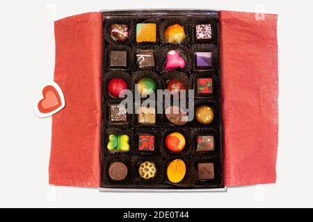 Handmade chocolates in a box, isolated on white background. View from above. Clipping path. Stock Photo