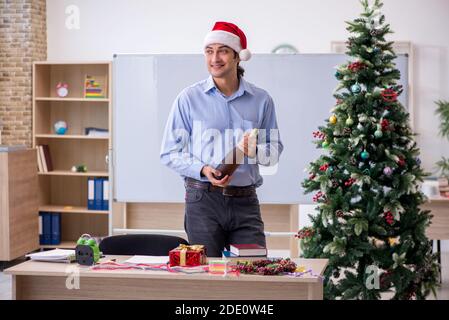 Young teacher celebrating new year at school Stock Photo