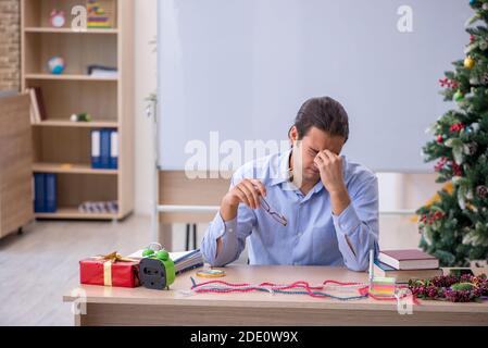 Young teacher celebrating new year at school Stock Photo