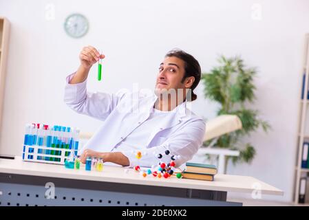 Young male chemist student working in the lab Stock Photo