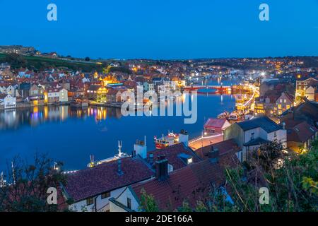 View of Whitby Bridge from across River Esk at dusk, Whitby, Yorkshire, England, United Kingdom, Europe Stock Photo