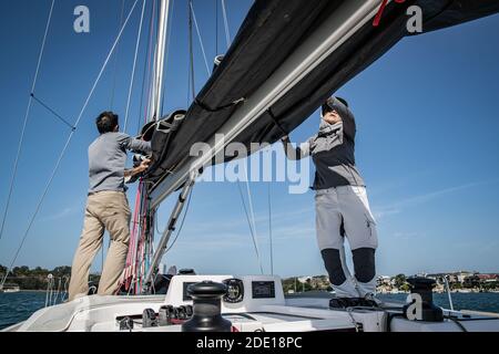 Sydney, Australia. 27th Nov, 2020. Jiang Lin (R) and Jean-Charles Ledun take a training sail ahead of Sydney Hobart Yacht Race in Sydney, Australia, on Nov. 27, 2020. Australia's 76th Sydney Hobart Yacht Race will go ahead in 2020, albeit with an almost entirely domestic fleet, race officials formally announced on Wednesday, ahead of the iconic December 26 start. Credit: Zhu Hongye/Xinhua/Alamy Live News Stock Photo