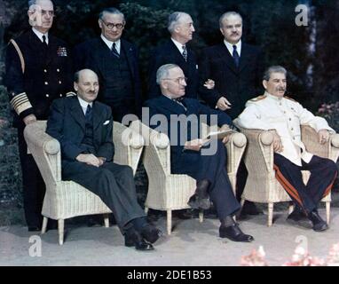 The 'Big Three' pose with their principal advisors, at Potsdam, Germany, circa 28 July -- 1 August 1945. The three heads of government are (seated, left to right):    British Prime Minister Clement Attlee;  U.S. President Harry S. Truman;  Soviet Premier Joseph Stalin. Standing behind them are (left to right): Fleet Admiral William D. Leahy, USN, Truman's Chief of Staff; British Foreign Minister Ernest Bevin; U.S. Secretary of State James F. Byrnes; Soviet Foreign Minister Vyacheslav Molotov. Stock Photo