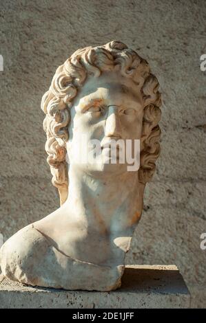 Bust of Helios, Sun God in sunlight, the statue is exhibited in Stoa of Attalos Museum of Ancient Agora, Athens Greece Stock Photo