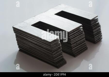 Ferromagnetic metal core for high energy efficient transformer. Ferrite transformer for switching power supply. Selective focus, shallow depth of fiel Stock Photo
