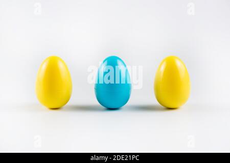 Three Colorful Plastic Easter Eggs on white background. Stock Photo