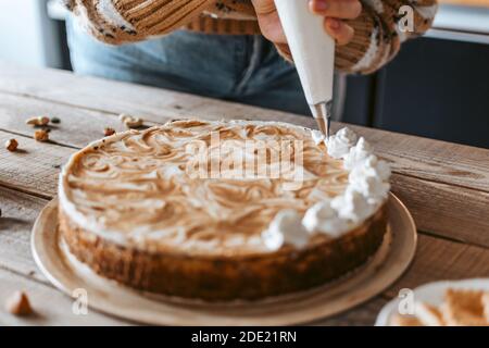 A shot of the cake decorating process Stock Photo