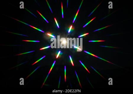 punctiform light source reflects the colors of the rainbow in all directions Stock Photo