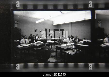Fine 1970s vintage black and white photography of the guys at the office. Stock Photo