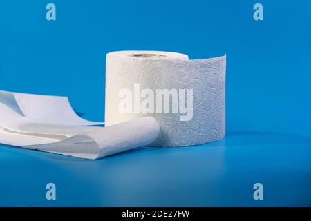Toilet Paper. Roll Of Toilet Paper On Blue Background Stock Photo