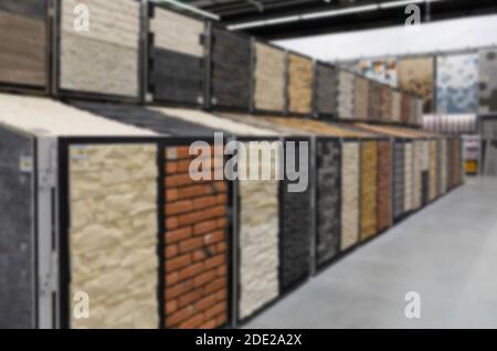 blurred and defocused: brick imitation plaster walls, samples in the store Stock Photo