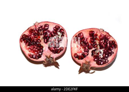 Cross section of pomegranate red fruit isolated on white background Stock Photo
