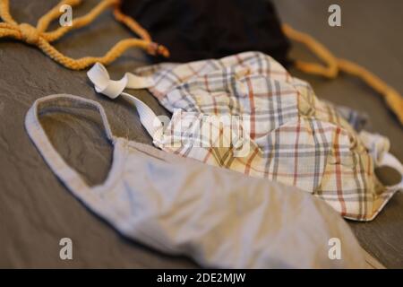 Corona Pandemic: Different Facemasks lying on a table Stock Photo