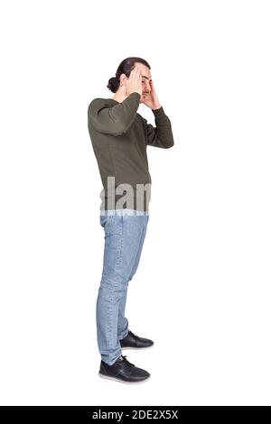 Side view full length portrait of stressed man feeling headache, pointing hands to temples isolated on white background. Guy suffering pain, mental he Stock Photo