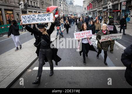 London, UK. 28th Nov, 2020. Protesters march from Marble Arch down Oxford Street. The Save Our Rights movement, organised the rally to unite people for freedom, justice and to develop a real democracy which they see as being under threat due to The Coronavirus Act. Credit: Andy Barton/Alamy Live News Stock Photo