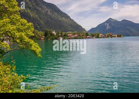 View on Walchensee Village from across the lake with the Bavarian Alps in the distance Stock Photo
