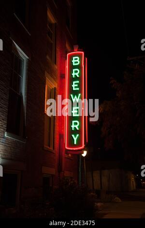 Neon brewery sign lights up the night. Stock Photo