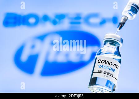 Izmir, Turkey / November 18 2020: Coronavirus vaccine concept and background. New vaccine pfizer and biontech isolated on blue background. Covid-19, 2 Stock Photo