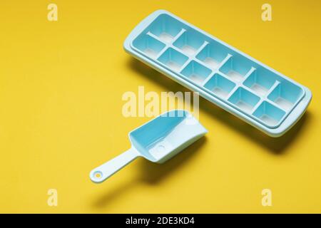 Blue plastic mold for making ice cubes for use in cocktails. Space for text. Stock Photo