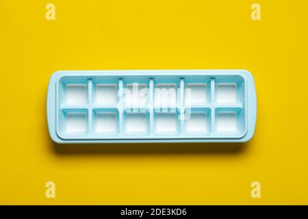 Blue plastic mold for making ice cubes for use in cocktails. Space for text. Top view. Stock Photo