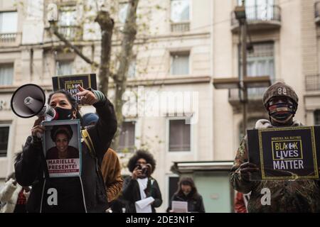 A protester speaking on a megaphone during the demonstration.The death of 40-year-old João Alberto Silveira, a black man after receiving a brutal beating by Carrefour vigilantes in the city of Porto Alegre, Brazil on November 19, has sparked a wave of protests in several Brazilian cities. In Barcelona anti-racist groups make an act of repudiation in front of the Carrefour in Las Ramblas. Stock Photo