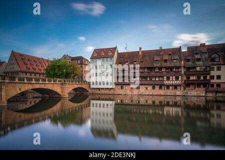 Resident buildings and Maxbrücke bridge over Pegnitz river, Nuremberg, Germany Stock Photo