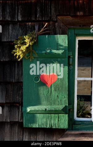 red heart painted on wooden shutter Stock Photo