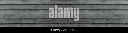 Texture of old gray wood, background of boards, panorama of an old burnt out wooden house. Stock Photo
