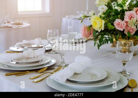 Tables festive set and flowers for a wedding reception. Stock Photo