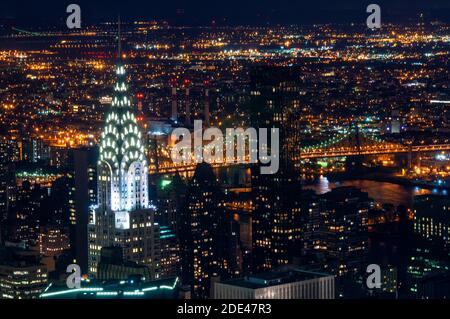 Aerial view  from the Empire State building. Night view of Lower Midtown with Chrysler Building in height projecting other impressive skyscrapers. Stock Photo