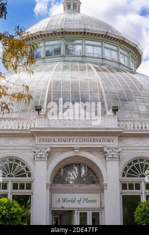 Enid A. Haupt Conservatory and pond with water lilies Greenhouse, New York Botanical Garden, Bronx, New York City, New York State, USA. Stock Photo