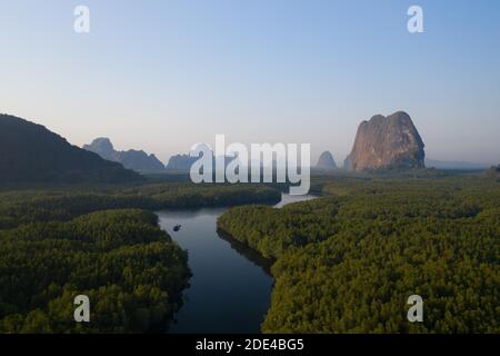 Aerial view, mangrove forest with meandering river and high karst rocks during sunrise, Ao Phang-Nga National Park, Phang-Nga Province, Thailand Stock Photo