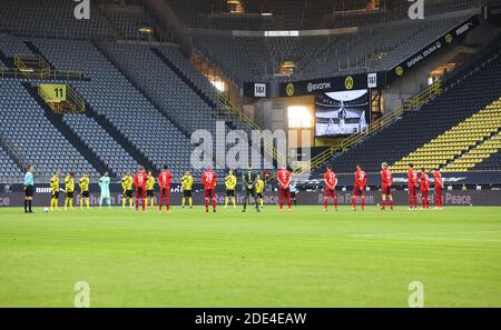 Dortmund, Germany. 28th Nov, 2020. Players and referees observe a moment of silence in tribute to late Argentine football legend Diego Maradona prior to a German Bundesliga football match between Borussia Dortmund and FC Cologne in Dortmund, Germany, Nov. 28, 2020. Credit: Juergen Fromme/firo Sportphoto/Pool/handout via Xinhua/Alamy Live News Stock Photo