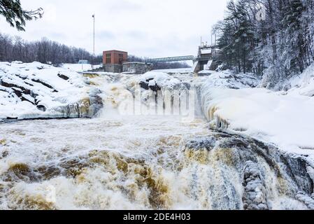 Hydroelectric dam of Saint-Narcisse on the Bastiscan river in the winter with snow and ice, Quebec, Canada. Stock Photo