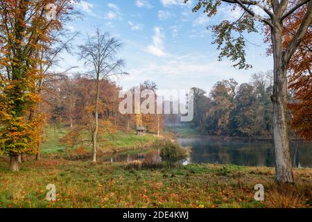 Cornwell Manor Estate grounds in autumn. Cornwell, Chipping Norton, Oxfordshire, Cotswolds, England. Viewed from the road. Stock Photo