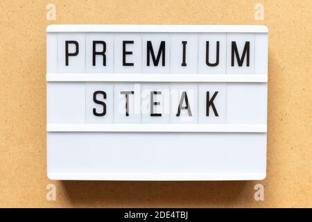 Lightbox with word premium steak on wood background Stock Photo