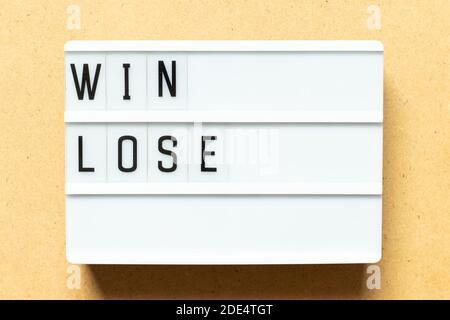 Lightbox with word win lose on wood background Stock Photo