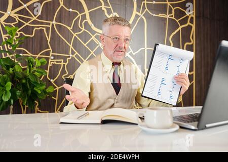 Man video calling business partner Stock Photo