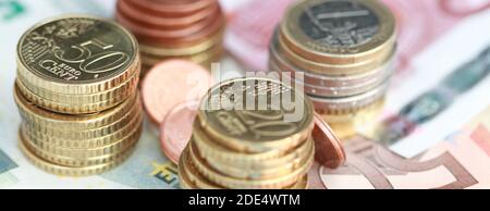 Banknotes and small change on a table Stock Photo