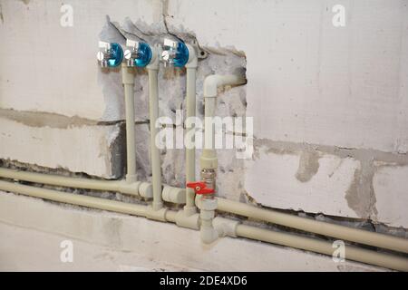 Installing and hide in wall water pipes in the house bath room. Groove or trench cut for water pipes. Stock Photo