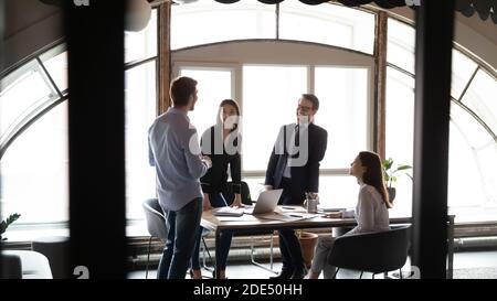 Diverse multiethnic coworkers having fun on seminar at conference room Stock Photo