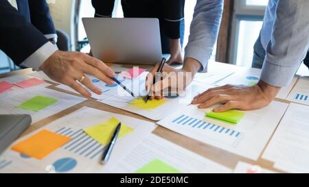Close up of diverse businesspeople working on project in team Stock Photo