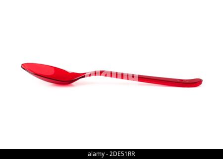Red plastic disposable spoon close up isolated on white background Stock Photo