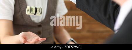 Focused photo on man that throwing bundle of money Stock Photo