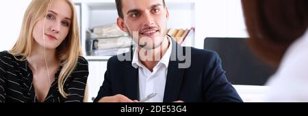 Attractive young woman looking straight at camera Stock Photo