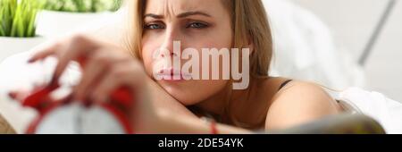 Exhausted female having headache after drinking wine Stock Photo