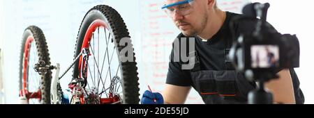 Handsome bearded male person making notes during work Stock Photo