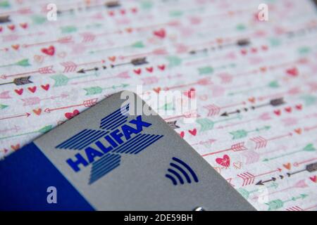 Durham, UK - 7 May 20: Plastic contactless Halifax bank card on patterned background. Halifax is a British bank and building society dealing in debit Stock Photo